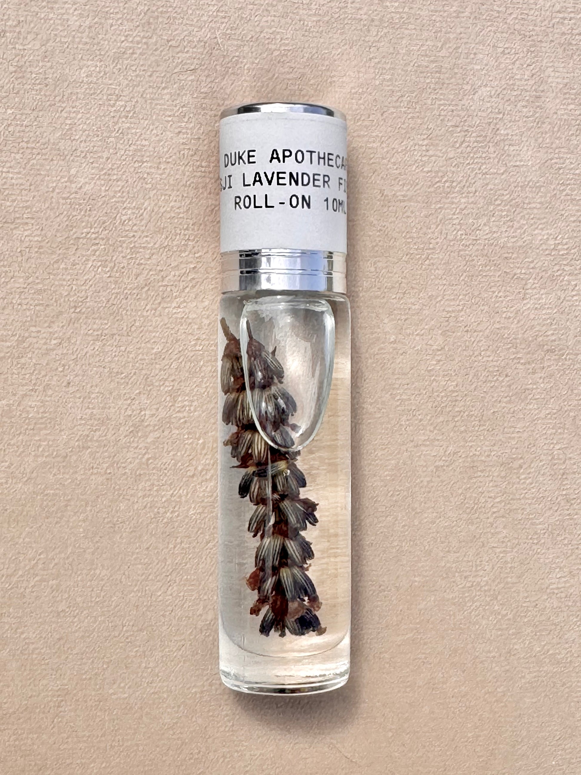 Duke Apothecary Lavender roll-on bottle on a beige background