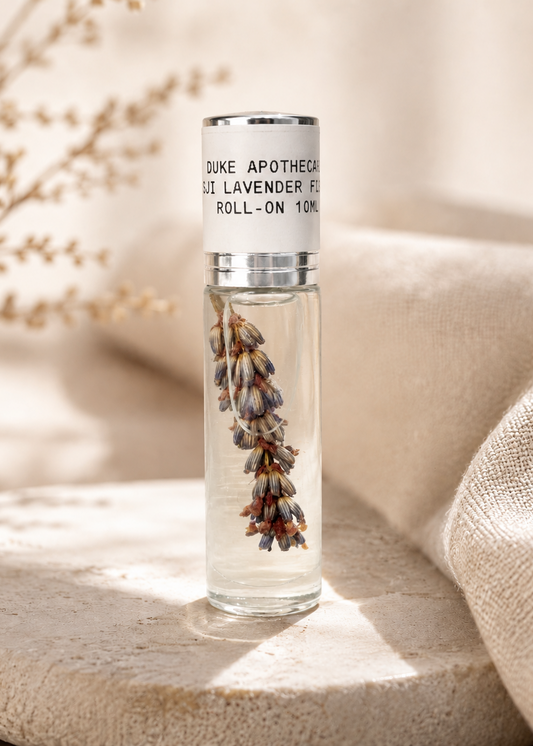 Roll-on bottle with lavender flowers on a textured surface