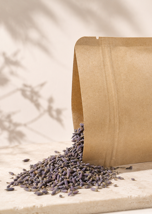 Kraft paper bag with lavender spilling out on a light background