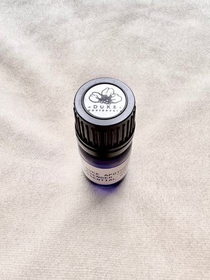 Small bottle with a Duke label on a textured surface